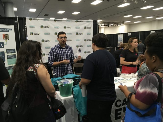 CEI volunteer speaks to students at the Careers in Energy booth at the Fresno County Superintendent of Schools’ Annual Career Tech Expo.